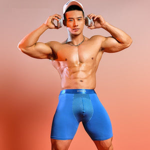 Male model wearing blue men's extended ice silk sports boxer briefs with breathable quick-dry compression fabric.