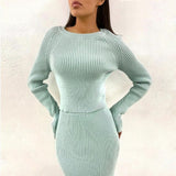 Woman wearing a light blue knit sweater and skirt two-piece set