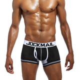 Male model wearing blue extended ice silk sports boxer briefs.