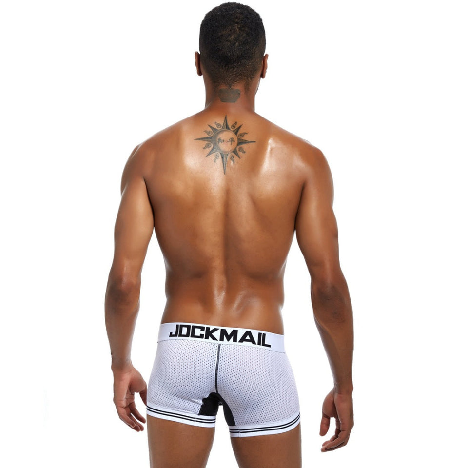 Male model wearing blue extended ice silk sports boxer briefs.