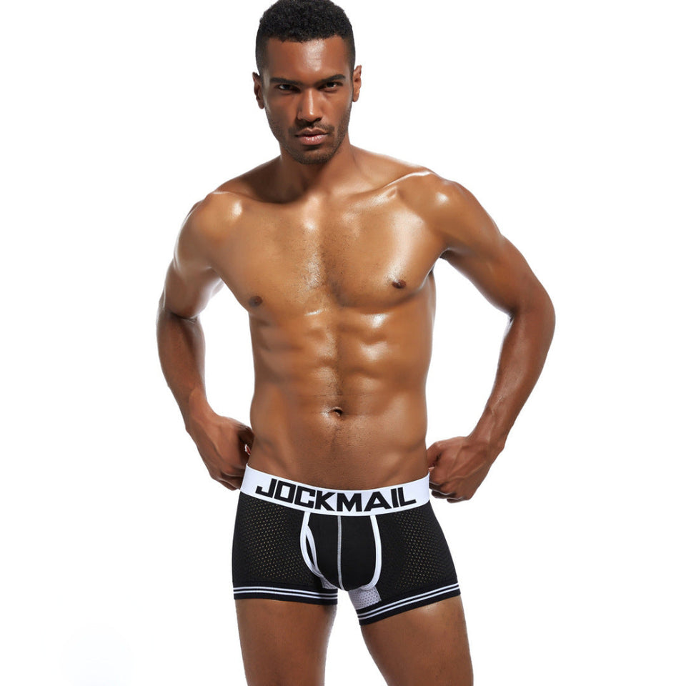 Male model wearing blue extended ice silk sports boxer briefs.