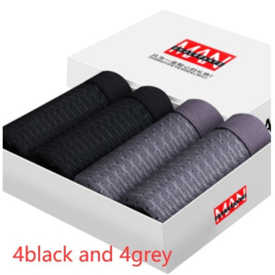 Four-pack men's boxer briefs in assorted colors.