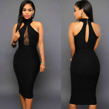 Woman wearing a black sleeveless halter neck bodycon midi dress with an elegant open-back design.
