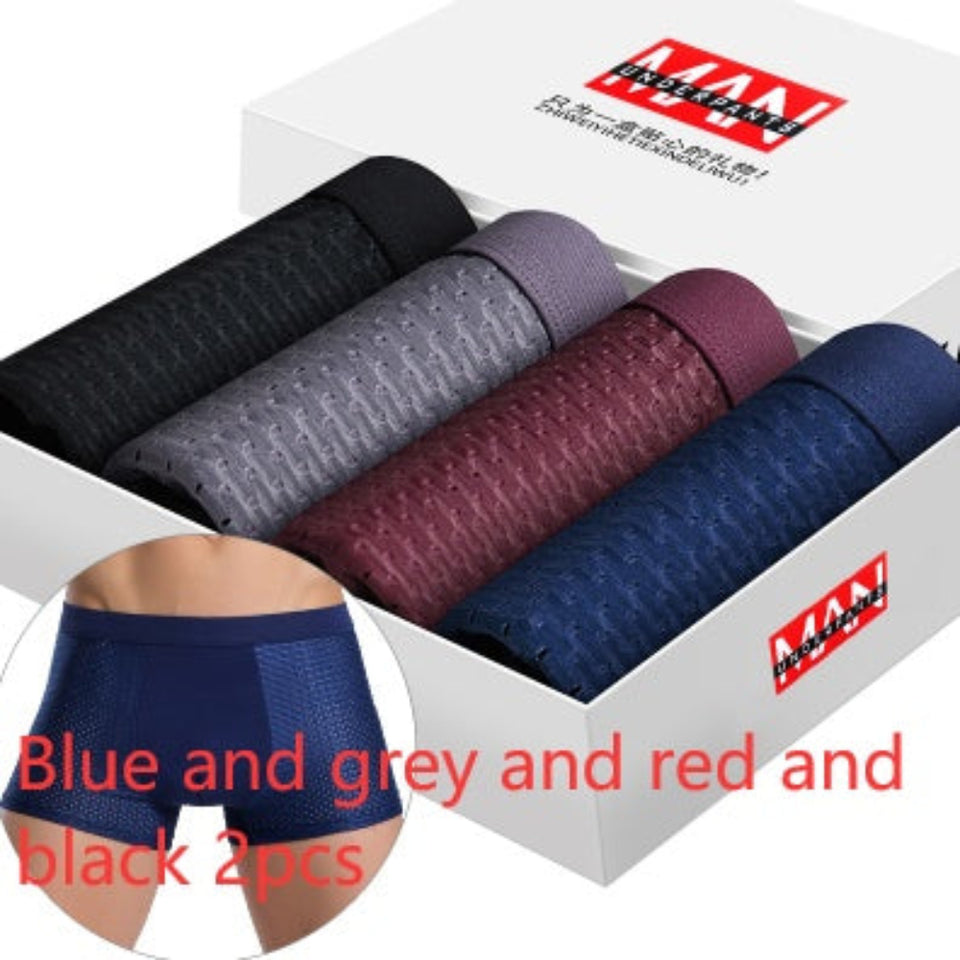 Four-pack men's boxer briefs in assorted colors.