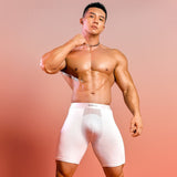 Male model wearing blue men's extended ice silk sports boxer briefs with breathable quick-dry compression fabric.
