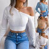 Woman wearing a white long sleeve button crop blouse