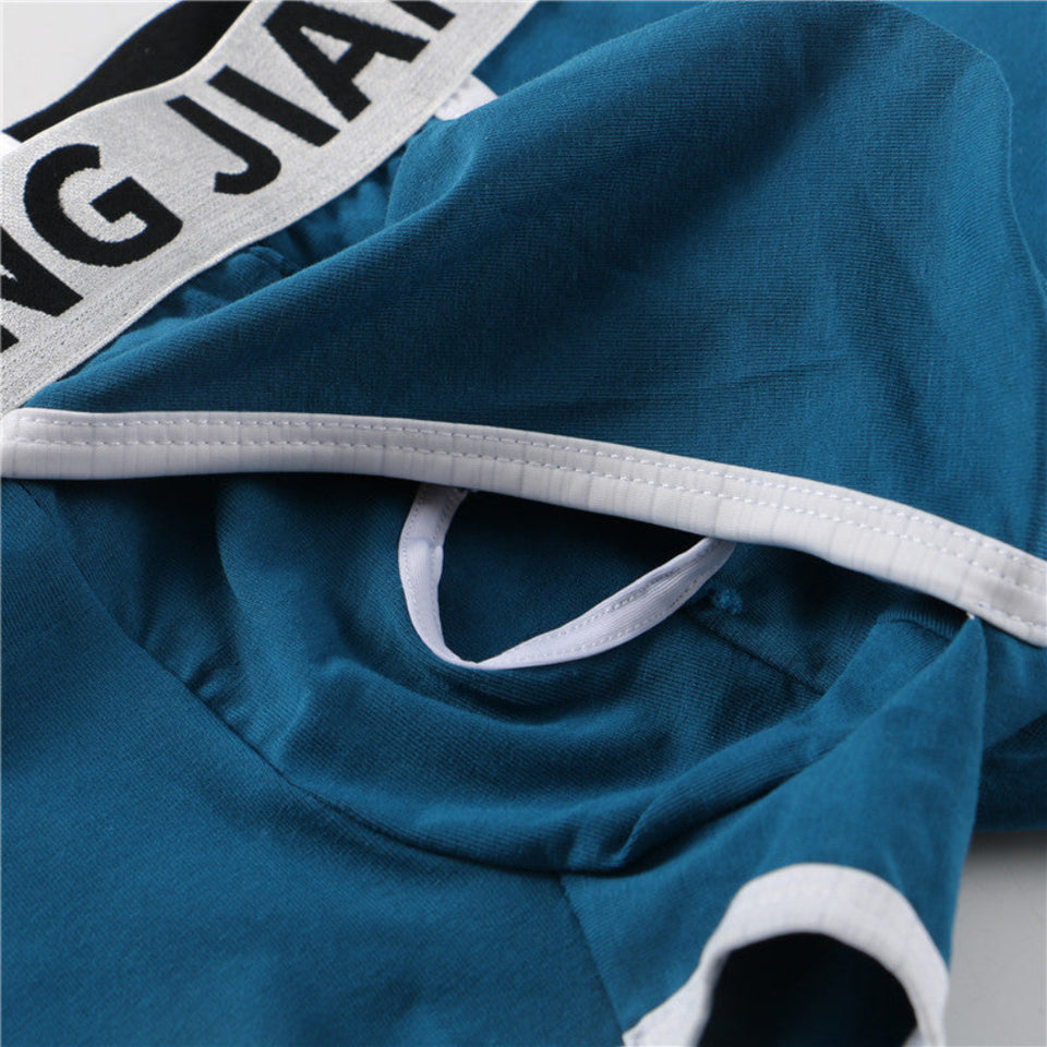 Men's cotton boxer briefs in black, blue, and white featuring breathable fabric, a supportive pouch, and a comfortable elastic waistband.