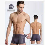 Four-pack men's boxer briefs in assorted colors.